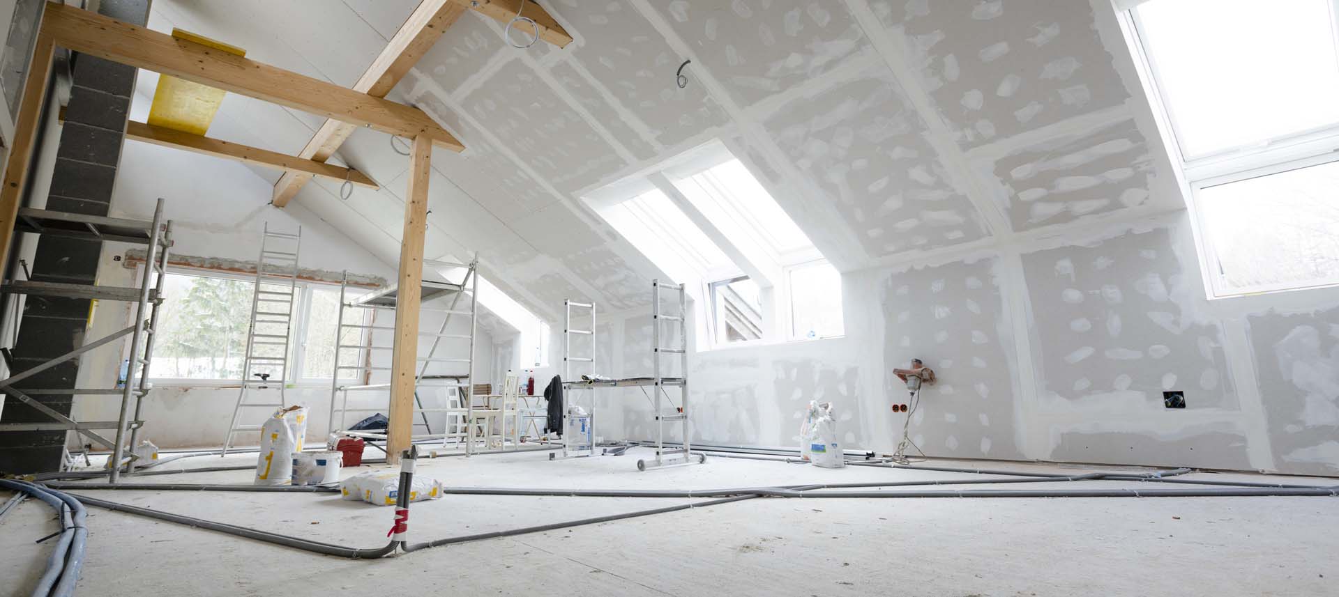 Attic finishing in the phase drywall spackling and plastering